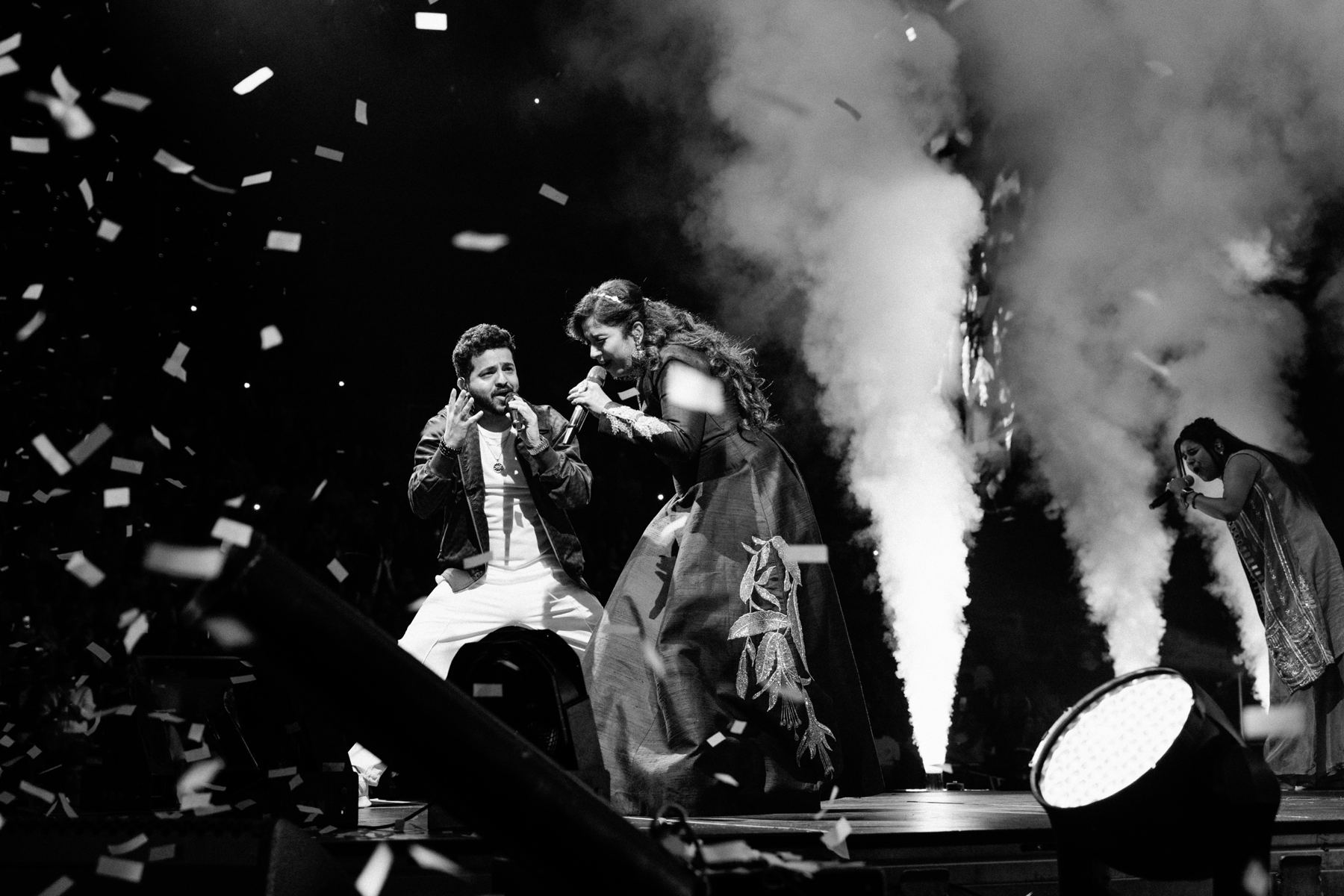 Duet face to face as confetti falls and CO2 jets fire